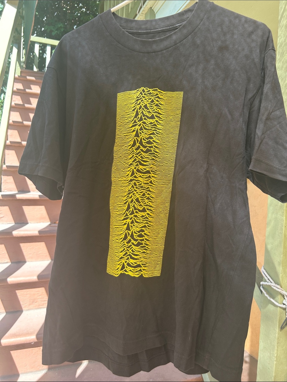 Uniqlo Black Short-Sleeve Tee with Yellow Wave Graphic